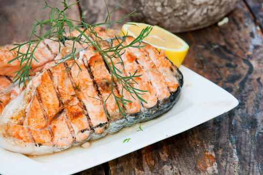 Salmon steak grilled with lemon