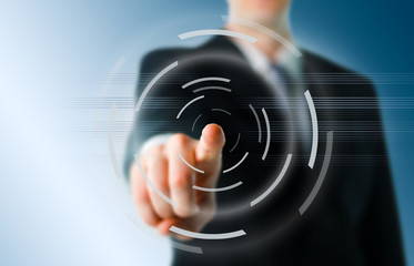 Businessman pointing at camera with digital elements