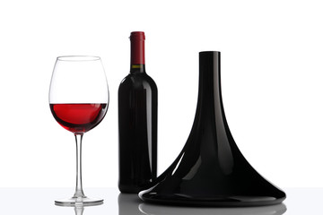 glass and bottle of red wine decanter