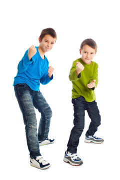 Two boys in a fighting stance.