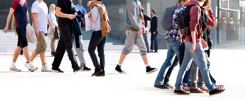 A large group of young people walking.