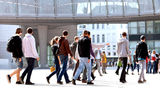 A large group of young men and women walking.