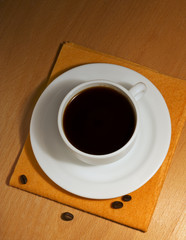 One coffee cup and saucer on a napkin