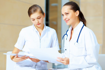 Portrait of two friendly female doctors