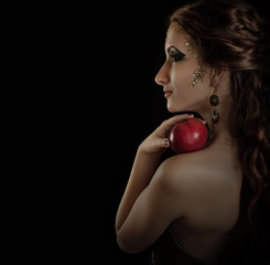 Portrait seductive posing girl with apple