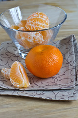 Fresh ripe mandarines on wooden background