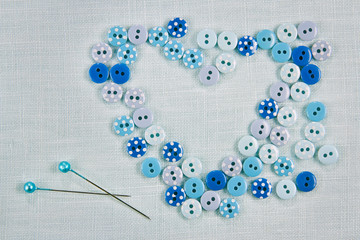 Sewing background - buttons as a heart