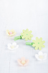 decorative flower pegs with sugar flowers on white old table