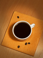 One white coffee cup on a napkin