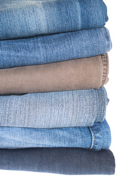 Jeans pile isolated on white background.