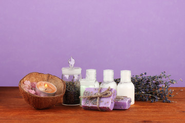 Obraz na płótnie Canvas ingredients for soap making on violet background
