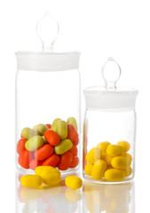 Transparent bottles with pills isolated on white