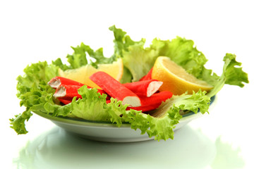 Crab sticks with lettuce leaves and lemon