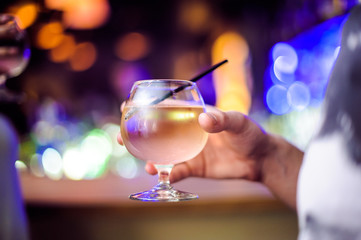 A glass of champagne at a nightclub