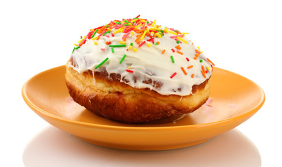 Tasty donut on color plate isolated on white