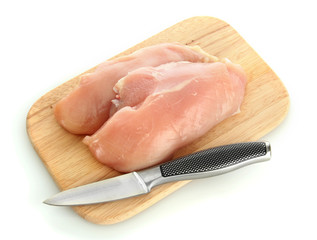 raw chicken meat on cutting board, isolated on white