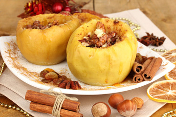 Baked apples on plate close up