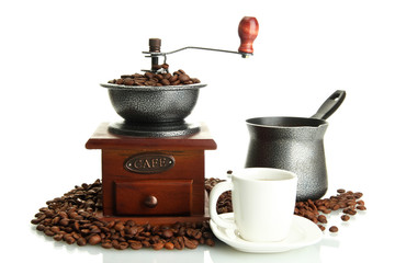 Coffee grinder, turk and cup of coffee with beans isolated