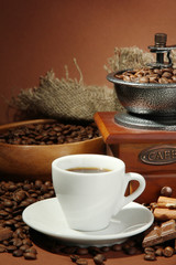 cup of coffee, grinder, turk and coffee beans