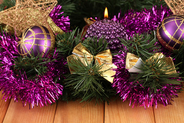 Christmas composition  with candles and decorations in purple