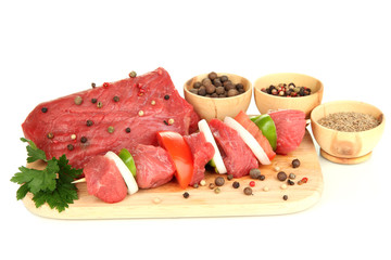 Raw beef meat marinated with herbs and spices isolated on white