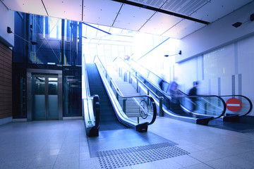 Subway escalator, pedestrians