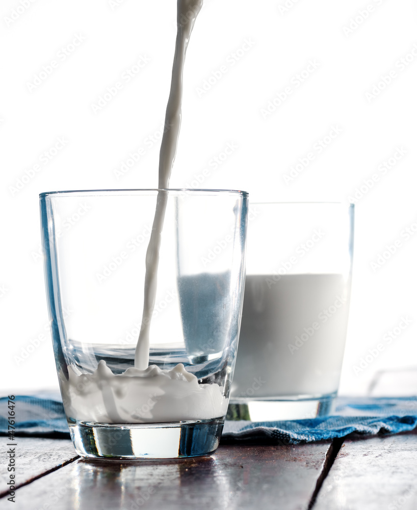 Wall mural glass of cow's milk on the table