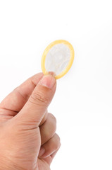 Hand with condom isolated on white