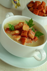 Hot soup with toasts in a bowl