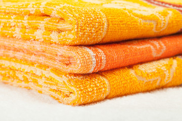 Fototapeta na wymiar Orange and yellow Towels