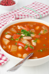 baked soup with beans, celery and bell pepper closeup