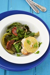 turkey roll with mangolde salad and lemon on the dish