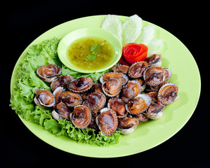 Grilled cockles seafood serves with spicy seasoning sauces