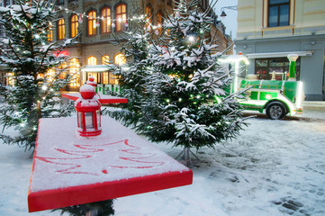 Street of city with chrismas trees and engine