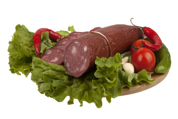 Sausage with vegetables on board