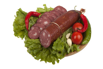 Sausage with vegetables on board