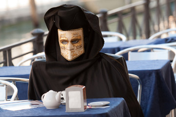 Mask in San Marco square during carnival of Venice