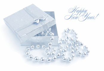 A little gift is with christmas beads on a white background