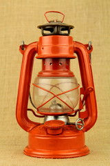 Red oil lamp on burlap