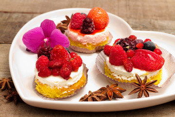 fruits cupcakes  over heart plate