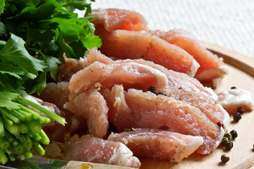 Fresh raw meat on wooden background with pepper