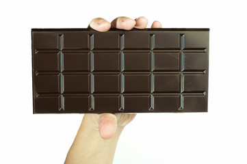 Hand holding chocolate bar