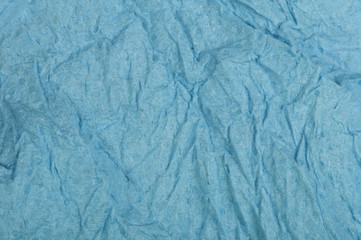 Crumpled blue paper