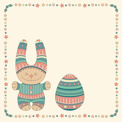 Ornamental bunny with a Easter Egg in a frame of stars and balls