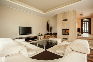 Travertine house: designer living room