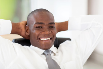 happy young african corporate worker in office