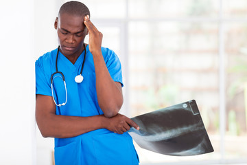 tired african american health care worker taking a break