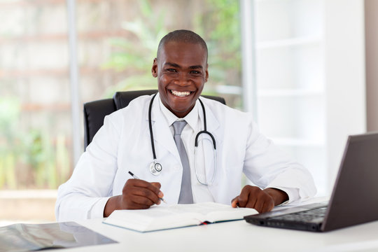 happy african american medical doctor in office