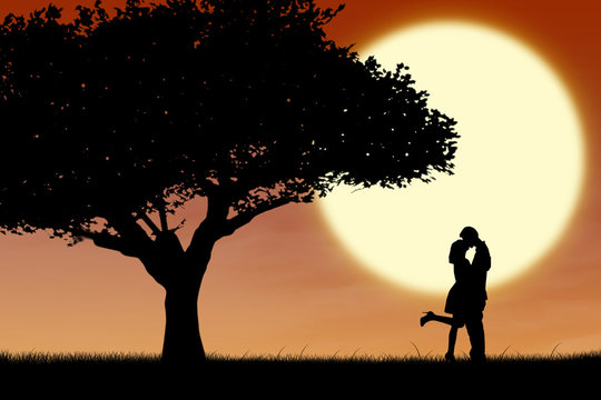 Couple kissing by orange silhouette and tree