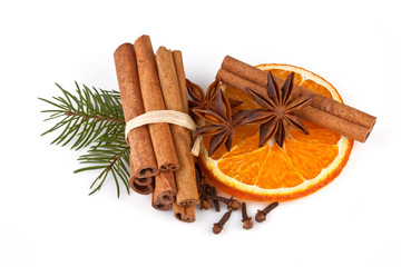 orange sliced, cinnamon with fir branch isolated on white